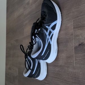 Black and white Asics running shoes